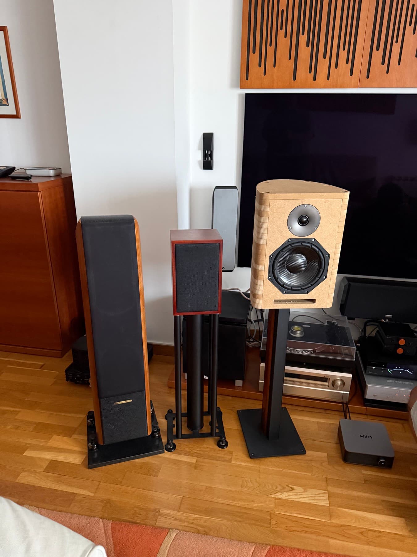 The MDF prototype on a stand next to a floorstander and a bookshelf speaker